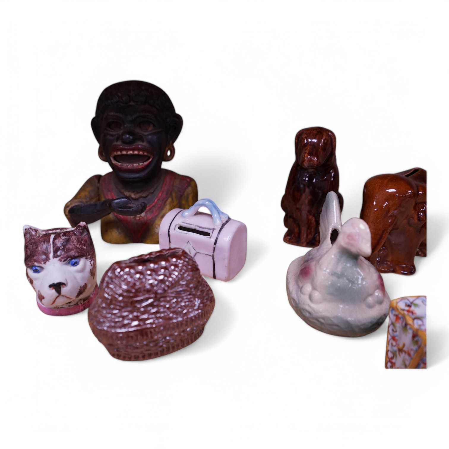 A collection of eight novelty money boxes, including a Dinah painted metal mechanical money box. Dinah money box 18cm high. Condition - some scuffing to paintwork and decoration on four.